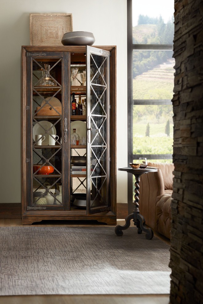 Great room - mid-sized rustic medium tone wood floor and brown floor great room idea in Denver with beige walls and no fireplace