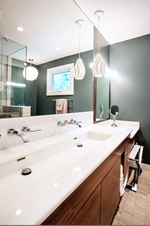 Large modern 3/4 bathroom in Toronto with flat-panel cabinets, dark wood cabinets, a corner tub, an open shower, a one-piece toilet, white tile, stone slab, white walls, linoleum floors, a trough sink and solid surface benchtops.