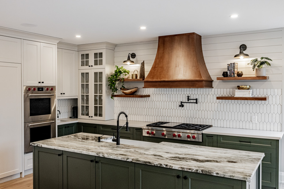 Inspiration for a large country l-shaped eat-in kitchen in Toronto with a farmhouse sink, shaker cabinets, white splashback, stainless steel appliances, light hardwood floors, multiple islands, beige floor and shiplap splashback.