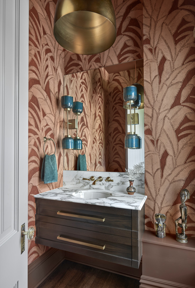 Example of a small transitional dark wood floor, brown floor and wallpaper powder room design in Chicago with an undermount sink, marble countertops, white countertops, a floating vanity, shaker cabinets, dark wood cabinets and multicolored walls
