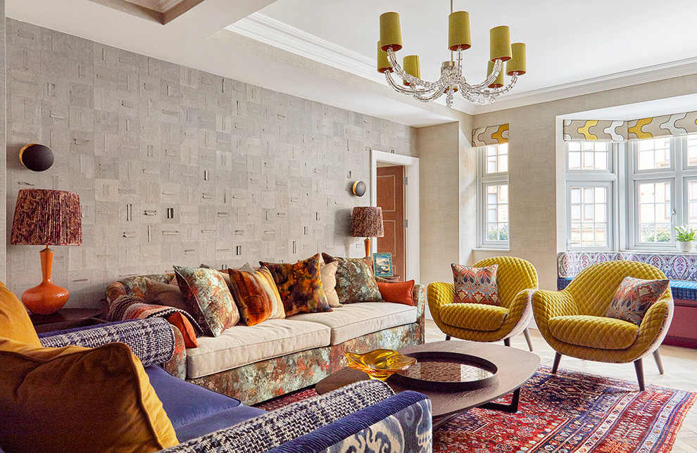 Photo of an eclectic formal living room in London with beige walls and light hardwood floors.