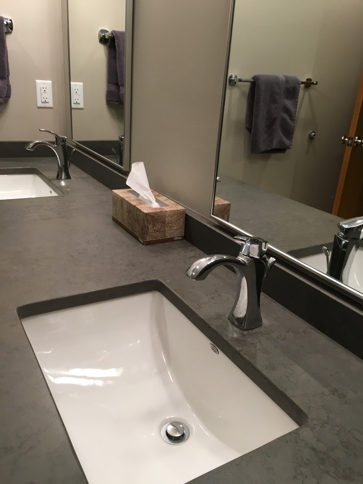 Alcove shower - large transitional master beige tile and porcelain tile porcelain tile alcove shower idea with flat-panel cabinets, dark wood cabinets, a two-piece toilet, green walls, an undermount sink and quartz countertops