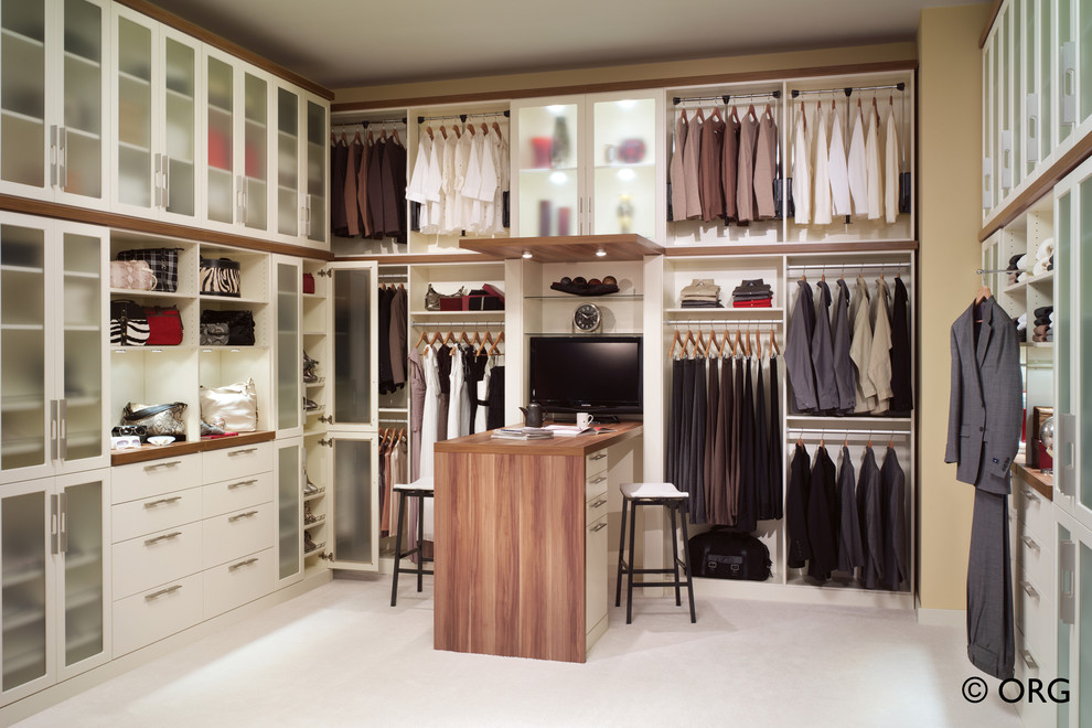Inspiration for a large contemporary gender-neutral dressing room in Denver with open cabinets, white cabinets and carpet.