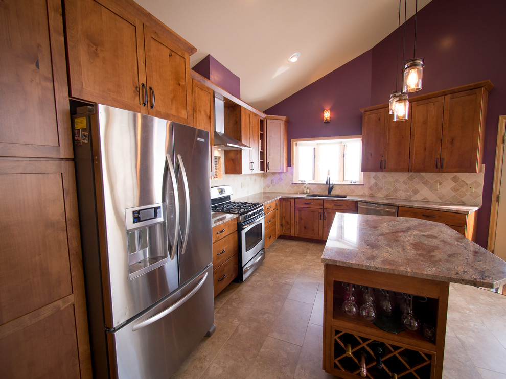 Open concept kitchen - large craftsman l-shaped ceramic tile and beige floor open concept kitchen idea in Denver with an undermount sink, shaker cabinets, medium tone wood cabinets, granite countertops, beige backsplash, ceramic backsplash, stainless steel appliances and an island