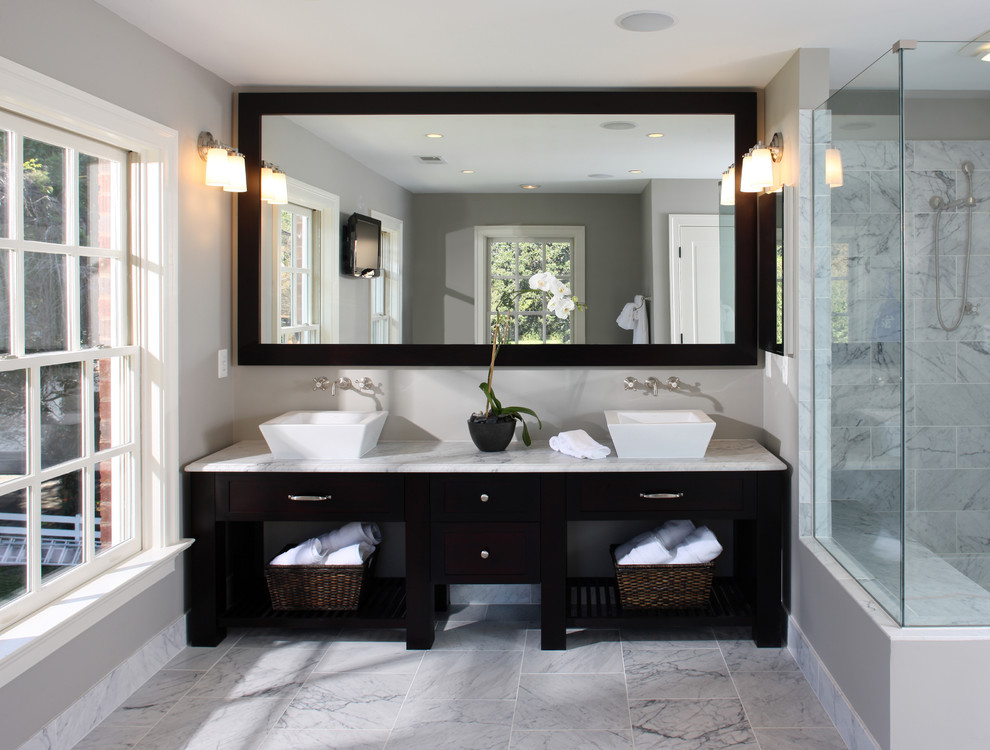 Inspiration for a transitional bathroom in DC Metro with marble benchtops, a vessel sink and marble.