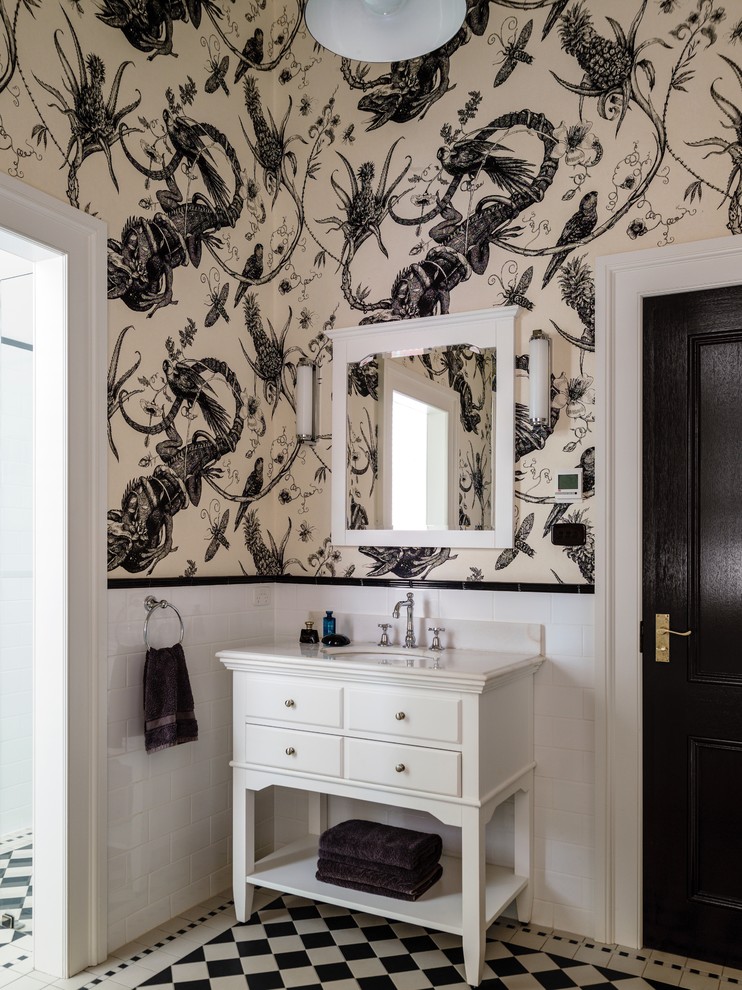 Large country kids bathroom in Sydney with an undermount sink, white cabinets, marble benchtops, white tile, ceramic tile, raised-panel cabinets, a drop-in tub, a two-piece toilet, white walls and ceramic floors.