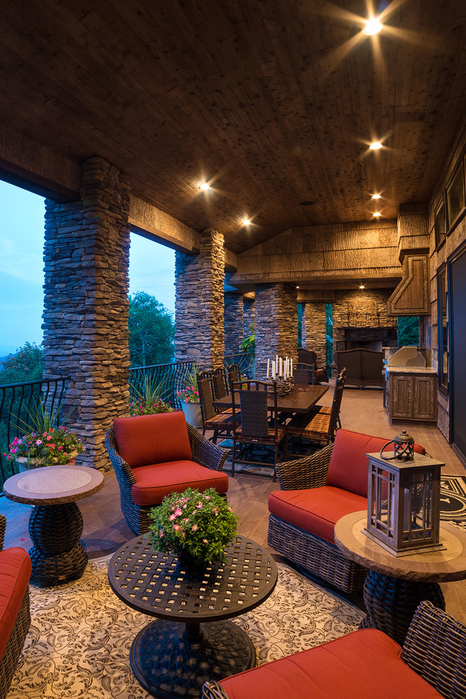 Outdoor kitchen deck - rustic outdoor kitchen deck idea with a roof extension