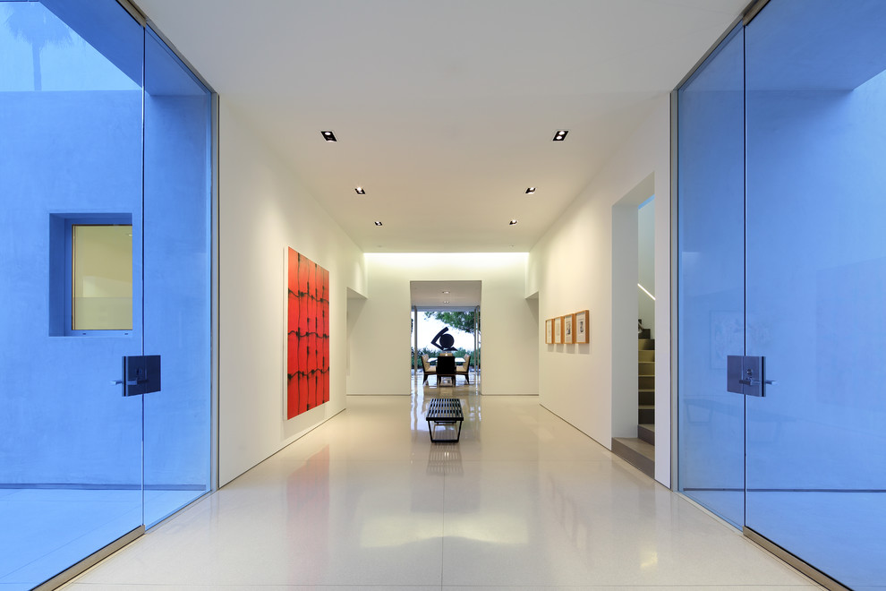 Photo of an expansive contemporary hallway in Los Angeles with white walls and linoleum floors.
