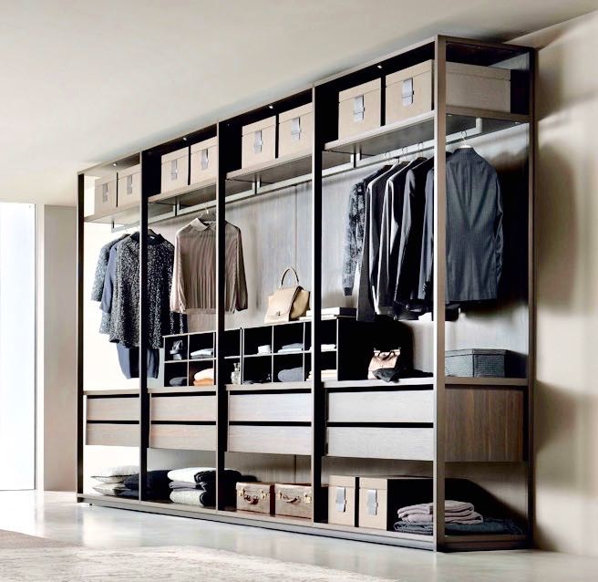 Design ideas for a large contemporary gender-neutral walk-in wardrobe in Miami with open cabinets, brown cabinets, concrete floors and grey floor.
