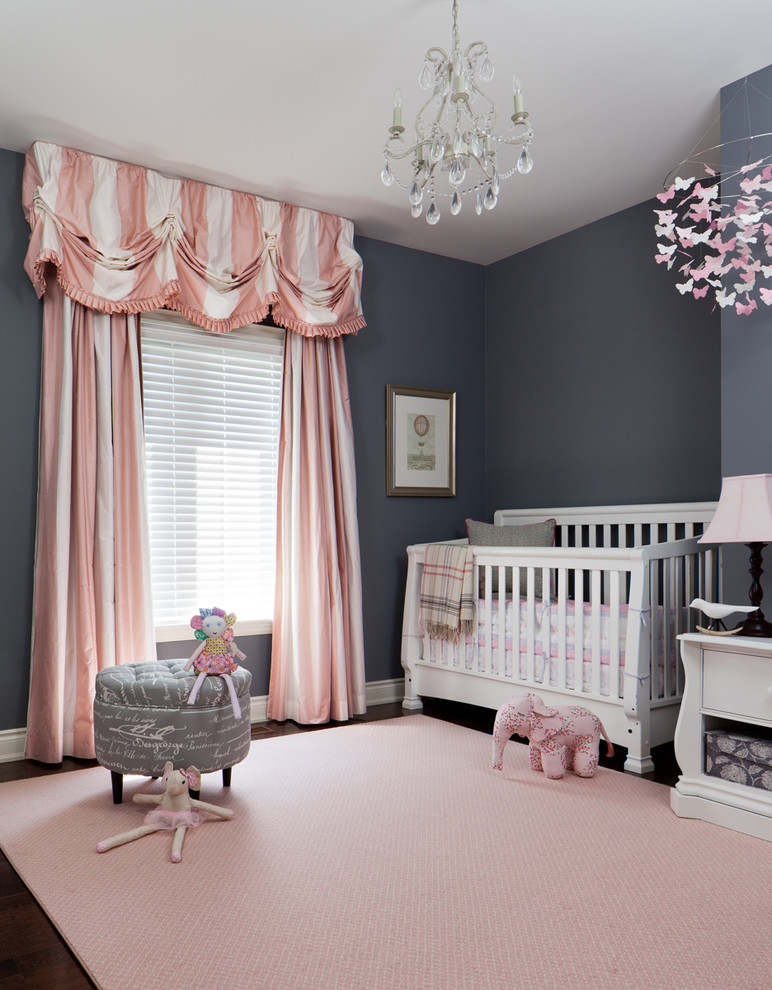 Design ideas for a mid-sized traditional nursery for girls in Toronto with grey walls.