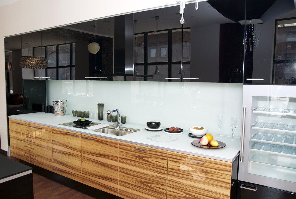 Large minimalist l-shaped medium tone wood floor and brown floor open concept kitchen photo in Brussels with a double-bowl sink, louvered cabinets, brown cabinets, stainless steel appliances and an island
