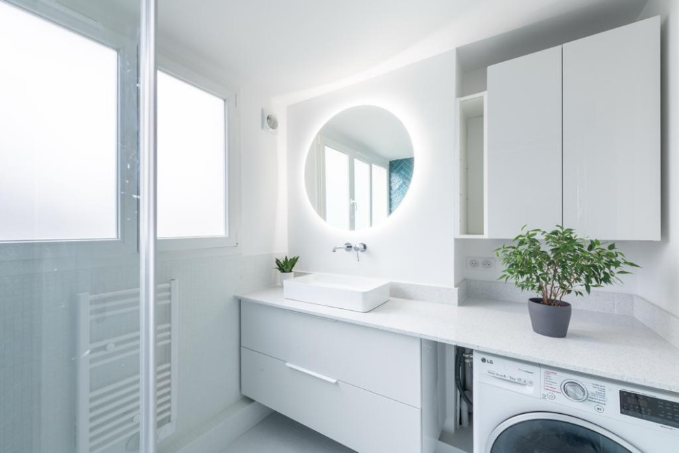 This is an example of a mid-sized contemporary master bathroom in Paris with a corner shower, a wall-mount toilet, blue tile, glass tile, blue walls, a vessel sink, white floor, a hinged shower door, grey benchtops, a single vanity and a floating vanity.