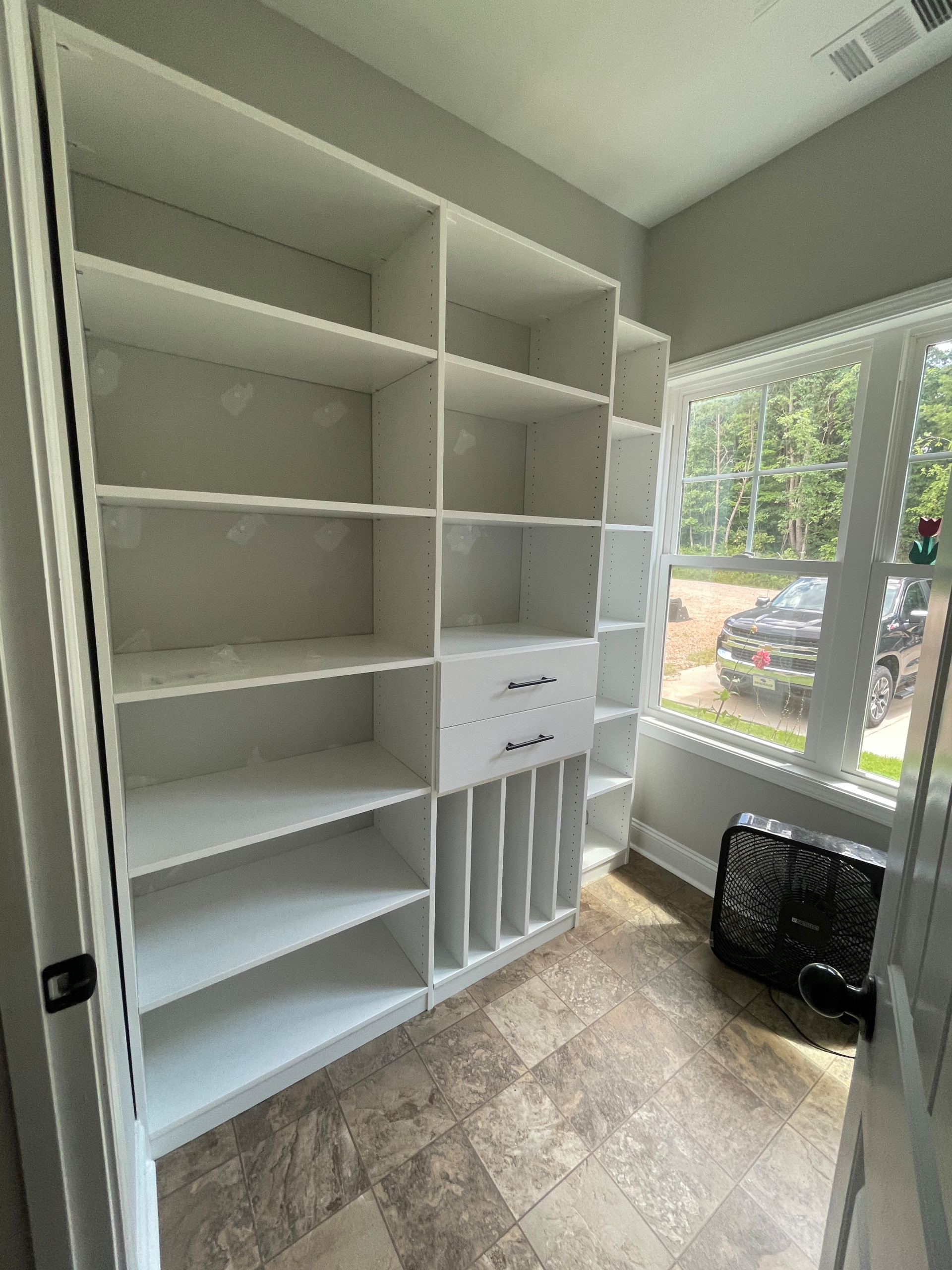 Pantry with Vertical Shelving, Drawers, and Adjustable Open Shelving