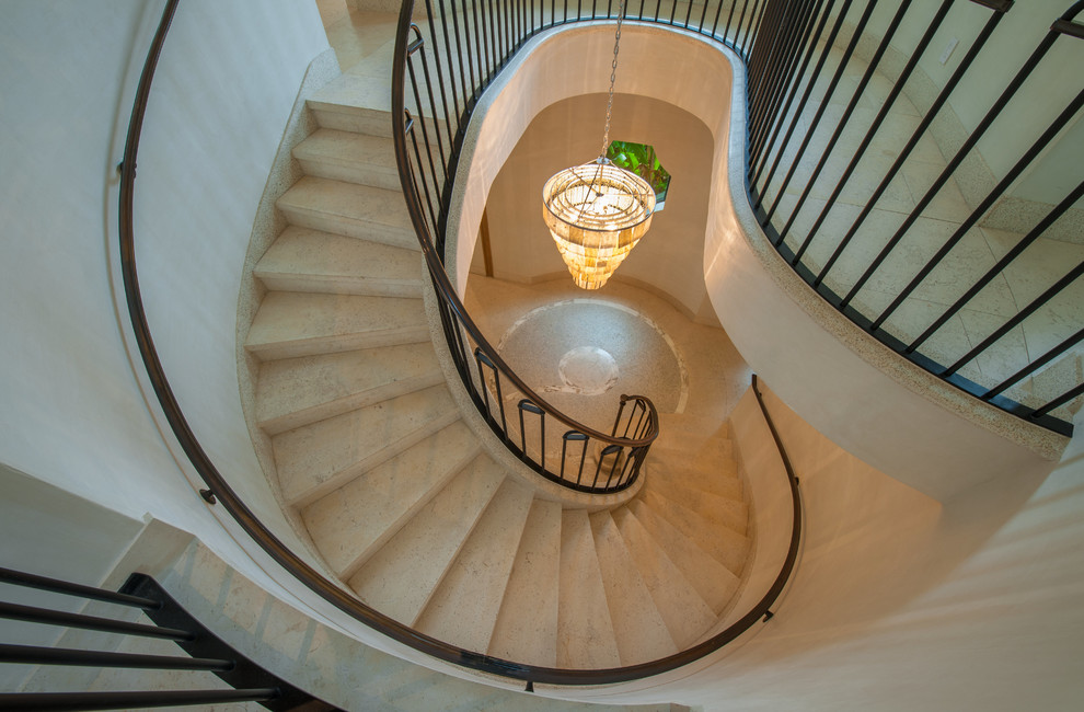 This is an example of a mediterranean curved staircase in Miami.