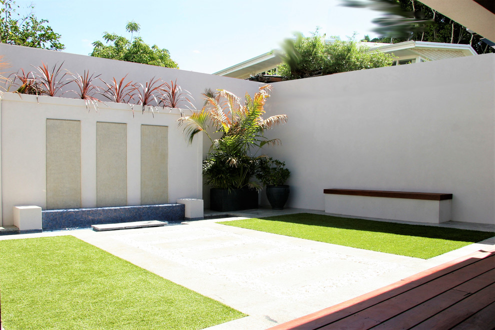 Inspiration for a mid-sized contemporary two-storey beige house exterior with stone veneer, a gable roof and a metal roof.