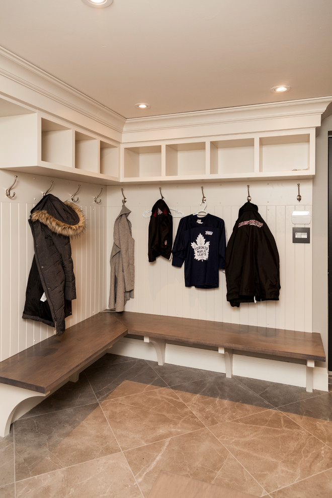 Inspiration for a large transitional mudroom remodel in Toronto