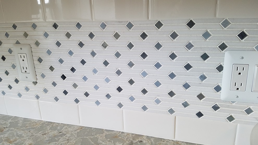 Example of a small transitional kitchen design in Detroit with white backsplash and subway tile backsplash