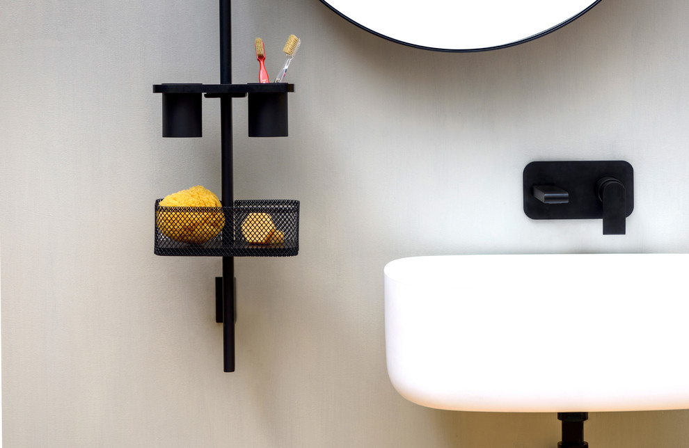 Inspiration for a modern bathroom in Dusseldorf with white walls and a wall-mount sink.