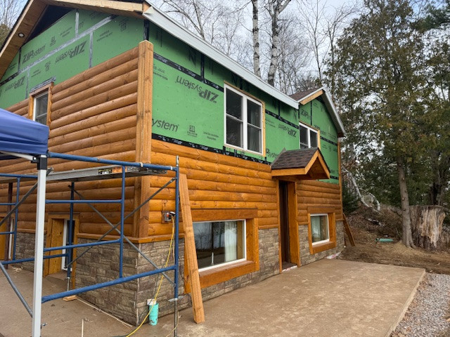 Log Siding, Stamped Concrete and Post and Beam Carport