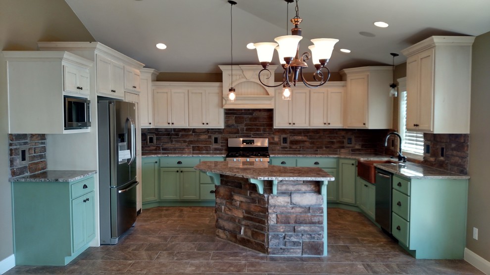Design ideas for a mid-sized country u-shaped eat-in kitchen in Other with a farmhouse sink, recessed-panel cabinets, turquoise cabinets, granite benchtops, stone tile splashback, stainless steel appliances and with island.
