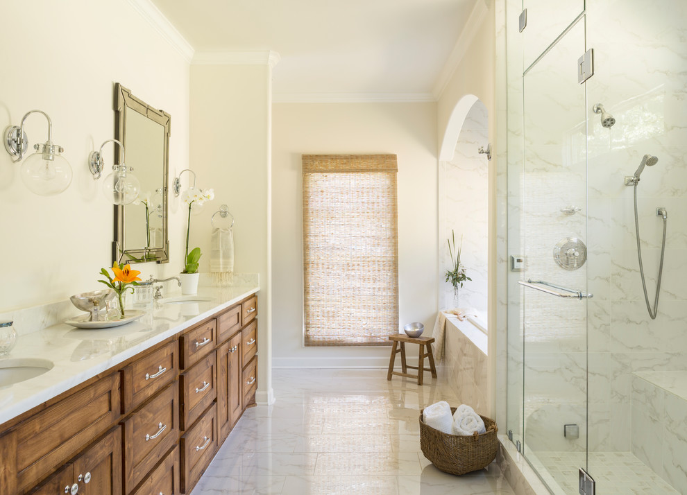 Design ideas for a large country master bathroom in Little Rock with shaker cabinets, dark wood cabinets, a drop-in tub, a corner shower, a two-piece toilet, multi-coloured tile, beige walls, ceramic floors, an undermount sink and engineered quartz benchtops.