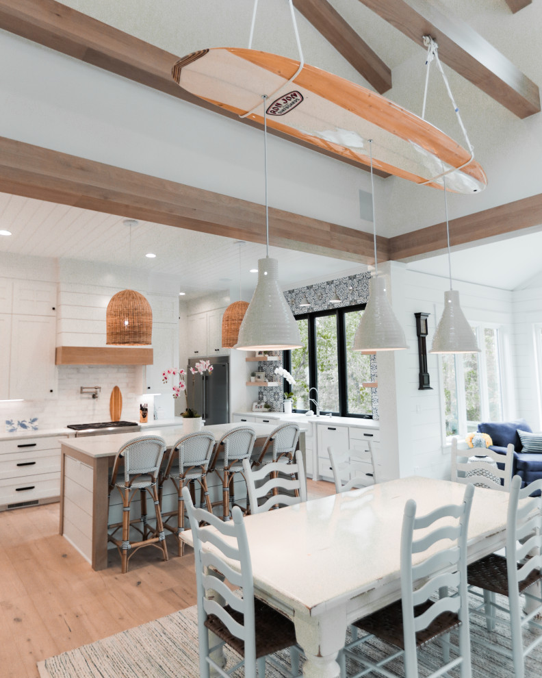 Inspiration for a beach style open plan dining in Other with light hardwood floors.