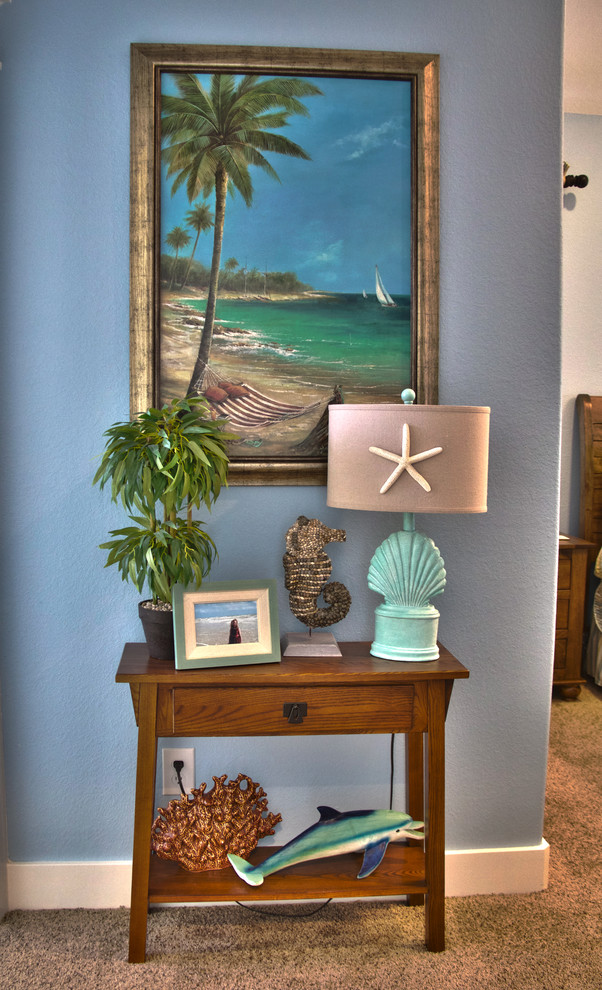 Inspiration for a small beach style hallway in Houston with blue walls and carpet.