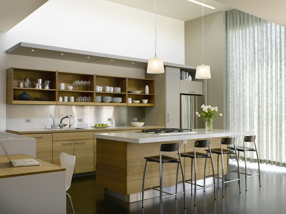 Contemporary galley kitchen in San Francisco with stainless steel appliances, a drop-in sink, open cabinets, medium wood cabinets, metallic splashback and metal splashback.