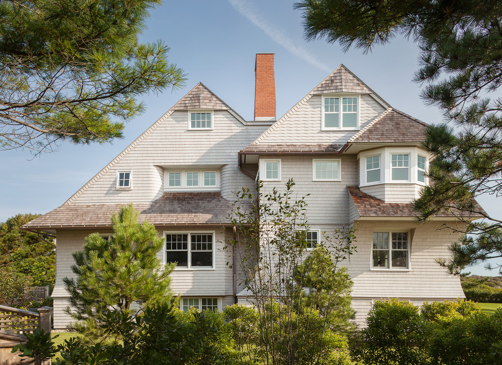 This is an example of a traditional three-storey exterior in Portland Maine with wood siding.