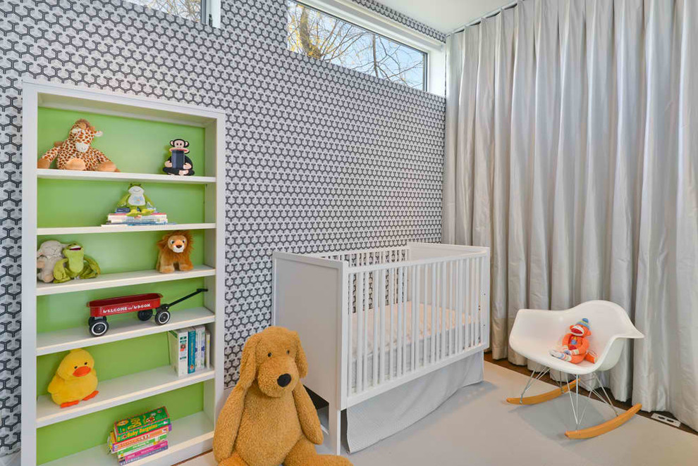 Contemporary gender-neutral nursery in Chicago with multi-coloured walls and medium hardwood floors.