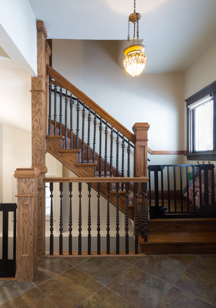 Example of a small transitional porcelain tile foyer design in Chicago with a dark wood front door