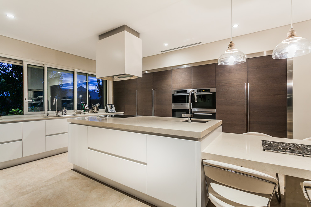 Contemporary galley kitchen in Perth with a drop-in sink, beaded inset cabinets, white cabinets, stainless steel appliances and with island.