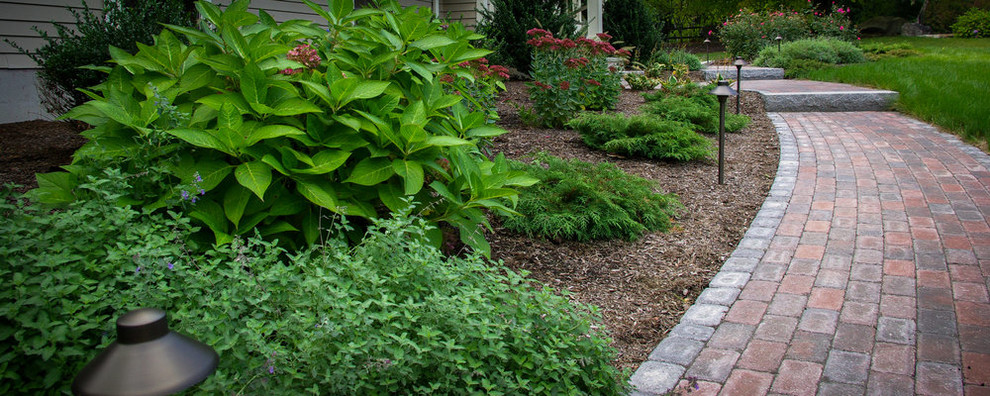Design ideas for an arts and crafts front yard garden in Boston with concrete pavers.
