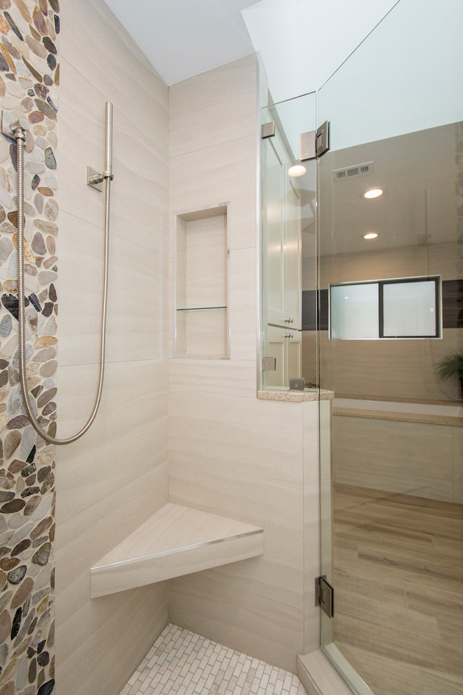 Mid-sized transitional master bathroom in Dallas with beige walls, light hardwood floors, beige floor, flat-panel cabinets, white cabinets, an alcove tub, a corner shower, a one-piece toilet, beige tile, porcelain tile, an undermount sink, engineered quartz benchtops and a hinged shower door.