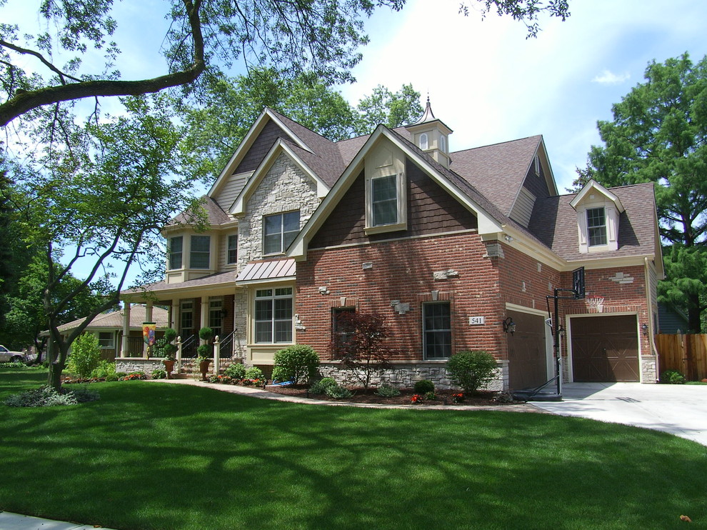 This is an example of a large traditional brick beige exterior in Chicago.