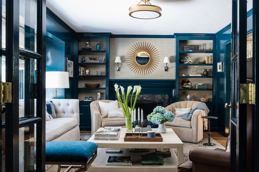 This is an example of a transitional formal enclosed living room in Boston with blue walls, medium hardwood floors and brown floor.