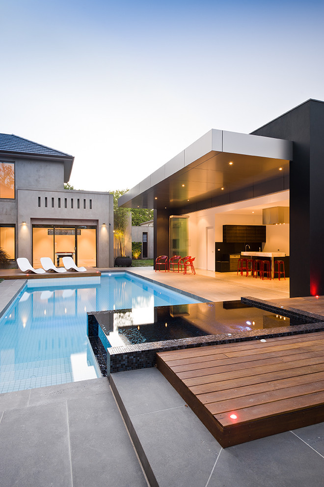 This is an example of a contemporary custom-shaped pool in Melbourne.