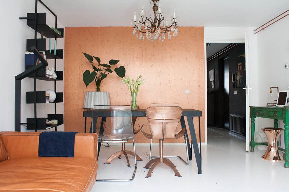 Photo of an eclectic dining room with white walls.