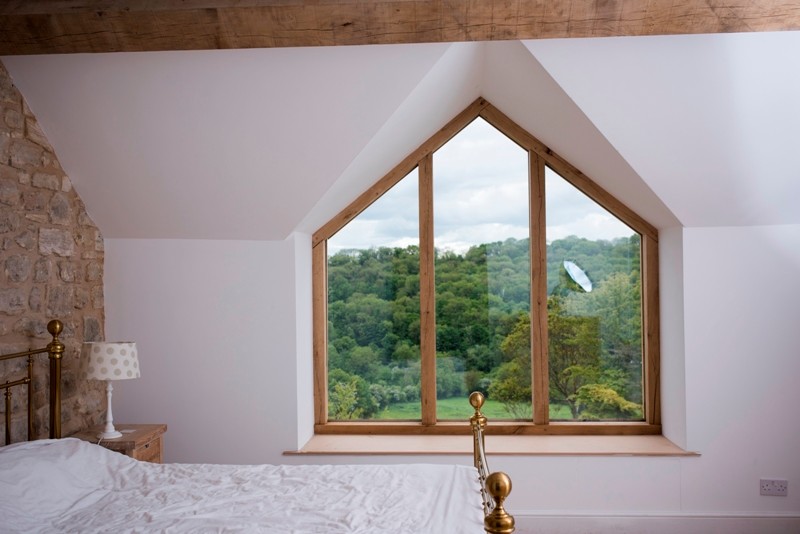 Photo of a large transitional bedroom in Wiltshire.
