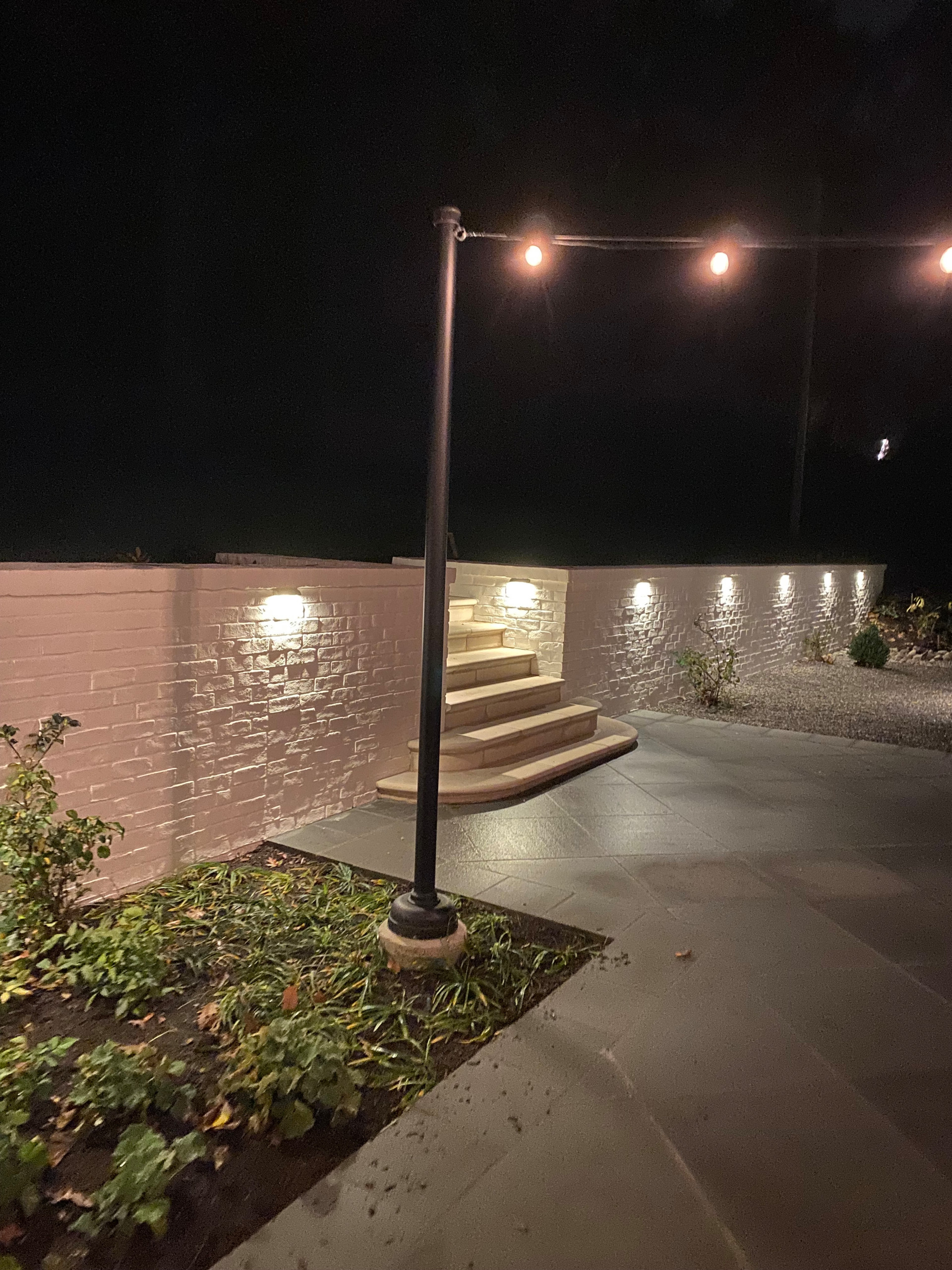 Brick retaining wall with steps