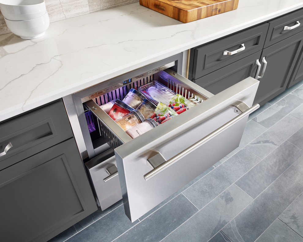 Enclosed kitchen - mid-sized transitional l-shaped ceramic tile and gray floor enclosed kitchen idea in St Louis with an undermount sink, recessed-panel cabinets, gray cabinets, granite countertops, beige backsplash, porcelain backsplash, stainless steel appliances and an island