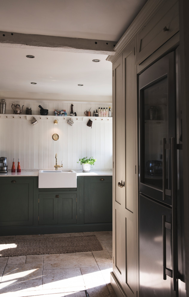 Design ideas for a mid-sized country kitchen in Surrey with flat-panel cabinets, green cabinets, metallic splashback, terra-cotta floors, no island and white benchtop.