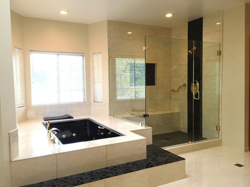 Inspiration for an expansive modern master bathroom in Los Angeles with raised-panel cabinets, medium wood cabinets, a hot tub, a corner shower, a one-piece toilet, beige tile, ceramic tile, beige walls, ceramic floors, a vessel sink and granite benchtops.