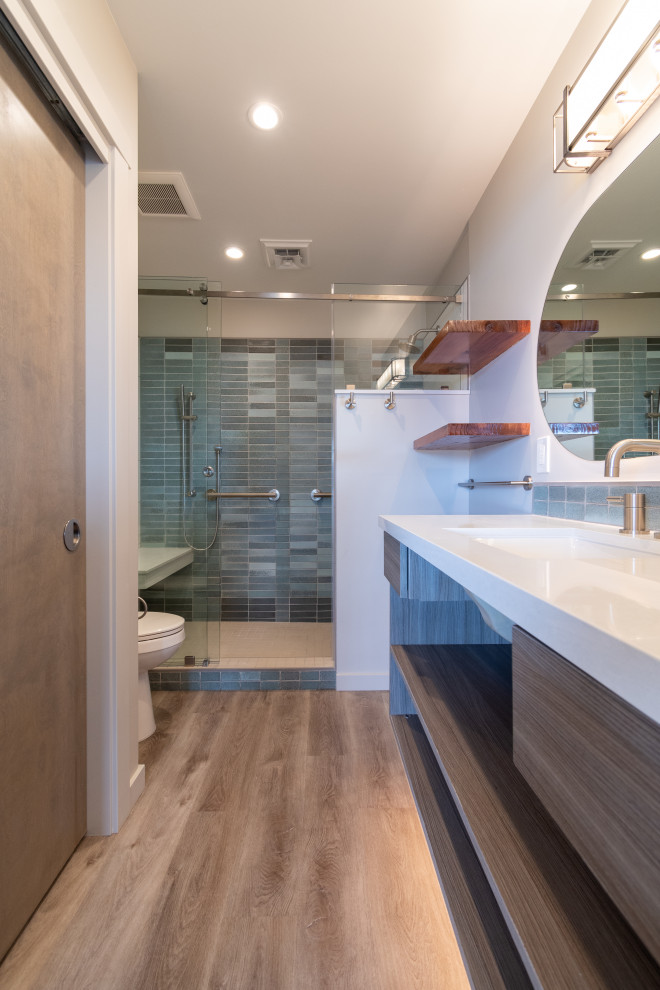 Photo of a small eclectic master bathroom in Other with open cabinets, brown cabinets, ceramic tile, white walls, an undermount sink, engineered quartz benchtops, brown floor, a sliding shower screen, white benchtops, a shower seat, a single vanity and a floating vanity.