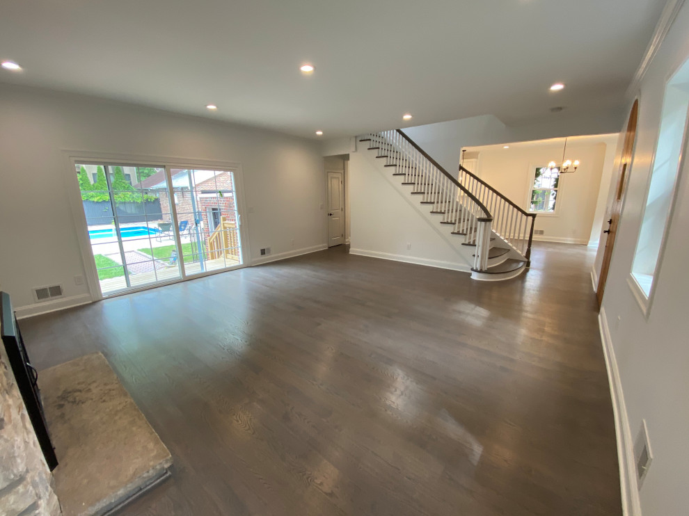 Open Living Room with Curved Staircase
