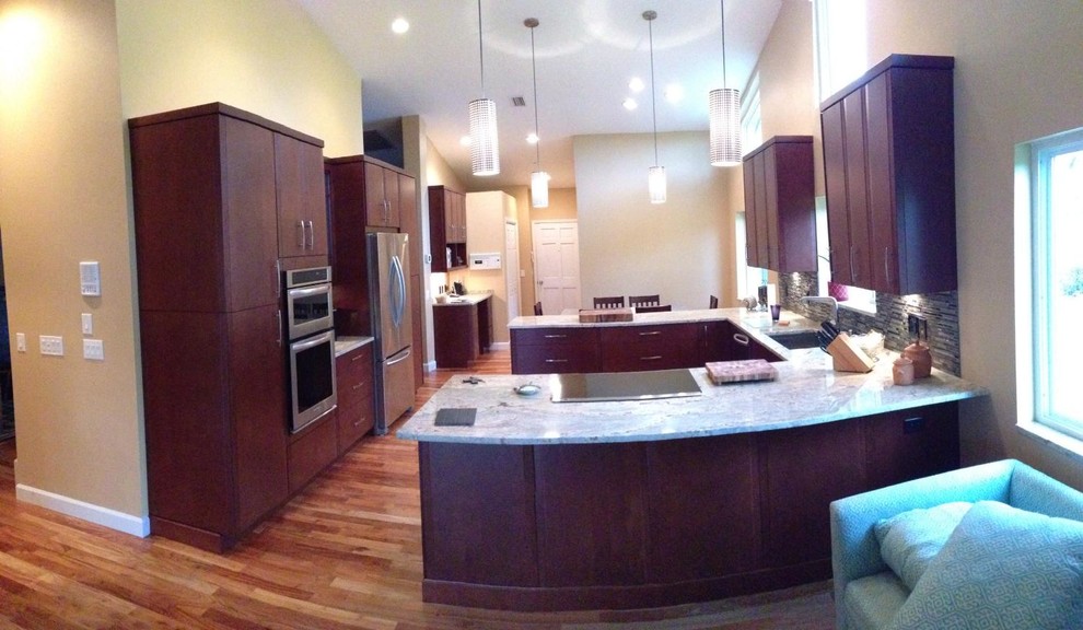 Inspiration for a huge transitional galley light wood floor eat-in kitchen remodel with flat-panel cabinets, white appliances and white walls