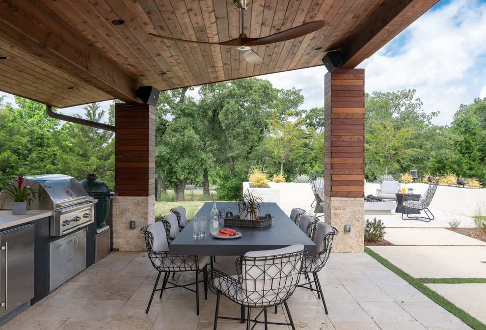 Design ideas for an expansive contemporary backyard patio in Dallas with a fire feature.