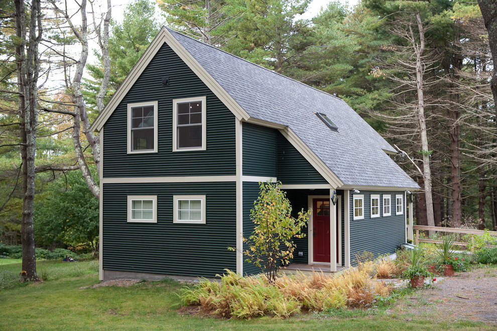 Photo of a mid-sized traditional two-storey exterior in Portland Maine with metal siding.
