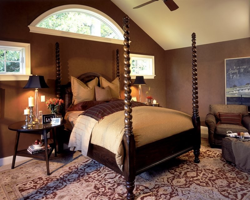 This is an example of a traditional bedroom in New York with beige walls and carpet.