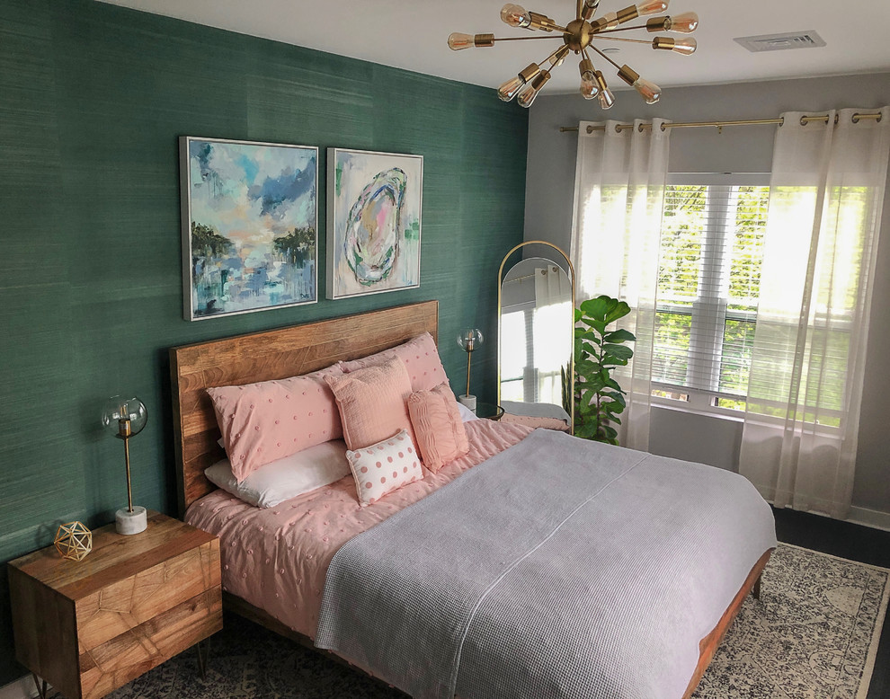 This is an example of a small contemporary master bedroom in Boston with green walls, dark hardwood floors and brown floor.